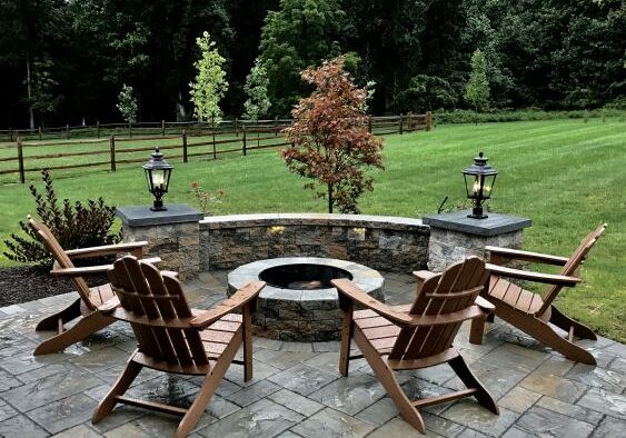 Wonderful outdoor living space with Techo-Bloc 60 pavers, siting wall and firepit.